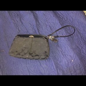 Only used once or twice. Coach wristlet.